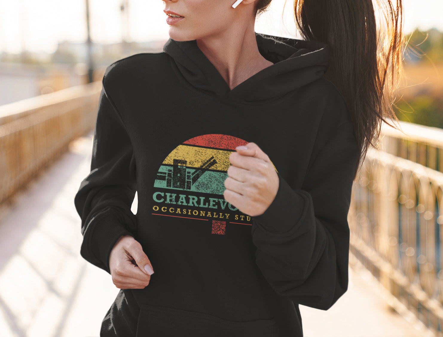 Woman running in Charlevoix Michigan while wearing occasionally stuck up hoodie